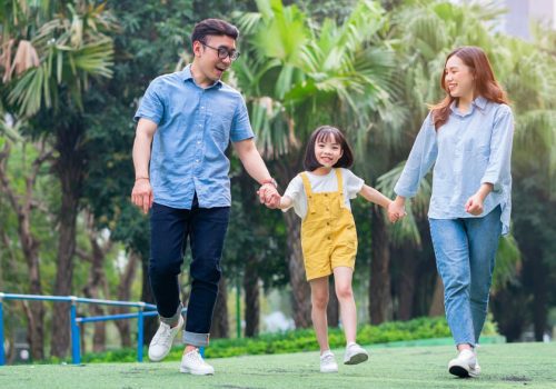image-young-asian-family-playing-together-park